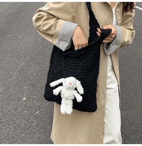 Black knit tote bag with 3D diamond texture and cute white bunny charm accessory