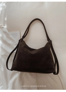 Close-up of retro dark brown faux suede material and texture on a large shoulder bag