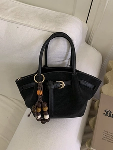 Black frosted suede tote bag with golden buckle and bohemian wooden bead charm detail