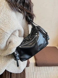 Retro black leather hobo bag with silver zippers and rivet details for stylish women