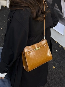 Vintage caramel quilted underarm bag with gold metal buckle and glossy finish