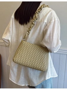 Chic quilted beige shoulder bag with scrunchie strap and minimalist square design