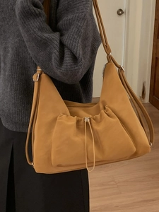 Chic mustard yellow convertible shoulder bag with drawstring pocket and multi-strap design