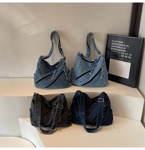 Detail view of four denim crossbody bags in light blue, dark blue, and carbon black shades