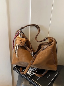 Brown large capacity vintage tote bag with plush bear charm and contrast stitching
