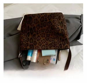 Interior capacity detail of large leopard print tote bag with daily essentials storage