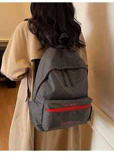 Minimalist black and white plaid backpack with red contrast zipper and large capacity