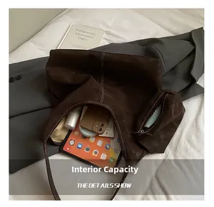 Deep coffee suede tote bag showing large capacity with laptop and inner pouch