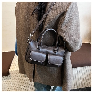 Brown vintage PU leather bag shown on model highlighting size and crossbody strap detail