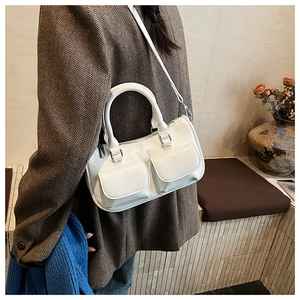 White leather handbag with double front flap pockets and silver hardware detail
