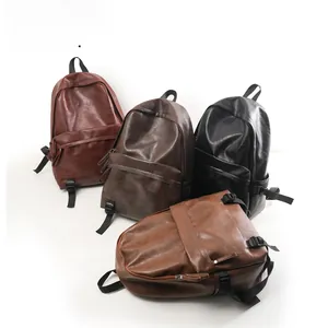 Detail view of four vintage faux leather backpacks in red, brown, black and tan colors