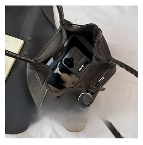 Deep gray-brown tote bag showing spacious interior for phone and cosmetics with top stitching