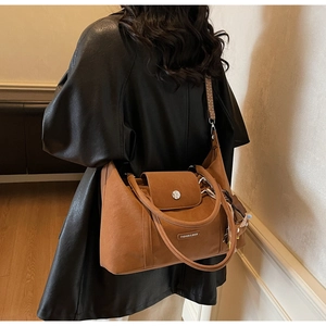 Detail view of the retro caramel brown matte tote bag showing the wide textured shoulder strap