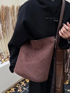 Retro dark brown faux suede tote bag with wide strap for autumn fashion styling