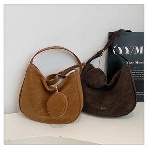 Detailed close-up of premium matte suede hobo bags in brown and dark coffee tones
