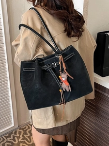 Fashionable black large capacity tote bag with white stitching and bear charm