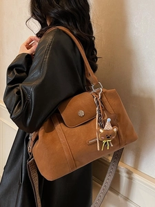 Vintage brown frosted tote bag with wide geometric strap and cute bear charm pendant
