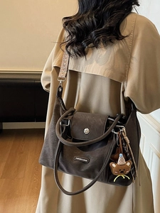 Retro dark brown matte tote bag with teddy bear pendant and woven shoulder strap