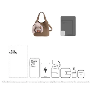 Detail showing khaki bucket bag capacity with icons for phone, umbrella, and essentials