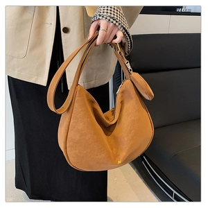 Detail of vintage brown matte hobo bag with a matching small zipper coin pouch attachment