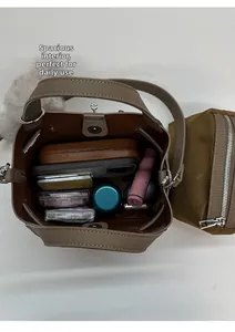 Detail view of brown bucket bag interior showing large capacity for daily essentials