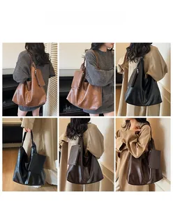 Detail view of large soft leather tote bag set including a matching small coin purse