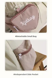 Detail der abnehmbaren herzförmigen Geldbörse und Seitentasche am rosa-grünen Rucksack