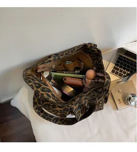 Detailed top view of large leopard print canvas tote bag showing spacious inner capacity