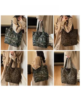 Detailed views of large canvas tote bags in camouflage and leopard prints worn by model