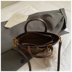 Top view showing the spacious interior double compartments of a vintage brown handbag