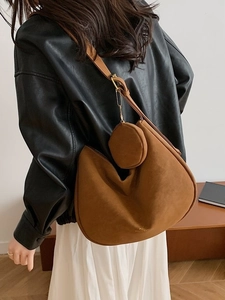 Caramel brown matte leather hobo bag with large capacity and round charm pendant