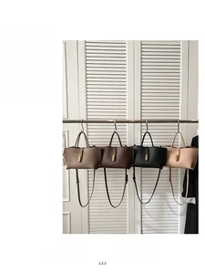 Detailed comparison of four retro leather bucket bags in taupe, brown, black and beige