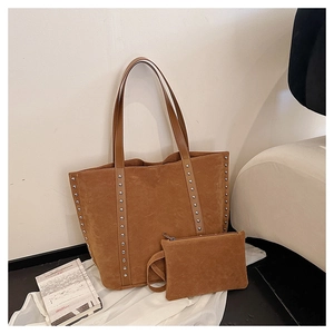 Caramel suede tote bag detail featuring silver rivet studs and matching small pouch