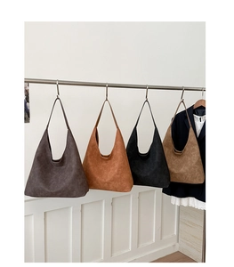 Selection of four vintage matte oversized hobo bags in assorted classic neutral colors