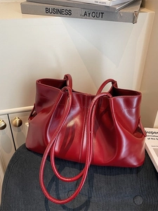 Large red pleated shoulder tote bag with minimalist high-gloss finish for women