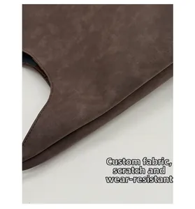 Close-up of scratch-resistant brown leather fabric with vintage textured tote surface