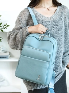 Light blue faux leather backpack for women featuring multiple pockets and rabbit logo
