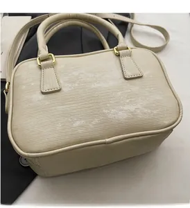 Macro shot of Boston bag with horizontal ribbed texture and gold metal hardware