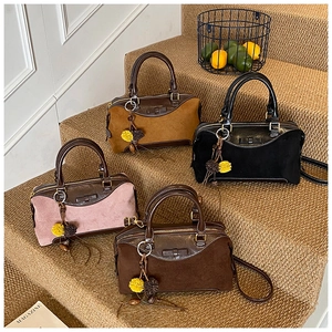Boston-style vintage handbag in four colors with a bow detail and floral charm