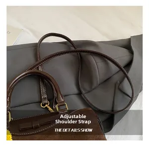Detail show of brown vintage textured pillow bag with adjustable shoulder strap