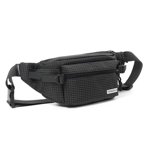 Detail view of the black plaid textured sling bag with adjustable buckle strap and logo