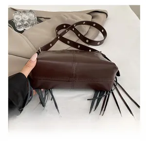 Detailed macro view showing the durable wear-resistant bottom and leather texture of the bag