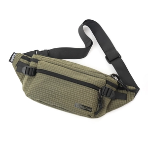 Detailed close-up of army green ripstop fabric and woven zip pullers on the chest bag