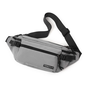 Detail of light grey checkered chest bag showing durable fabric and zipper pockets