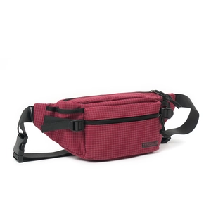 Macro detail of red checkered waist bag featuring durable fabric and black buckle