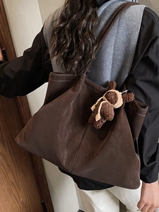 Deep coffee oversized tote bag with white stitching and decorative bear charm