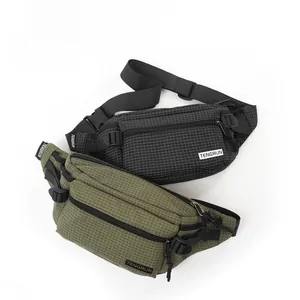 Detail view of durable checkered fabric and TENGRUN logo on trendy crossbody bags