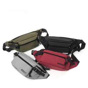 Detailed view of durable ripstop nylon texture and zipper pockets on outdoor crossbody bags