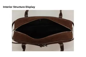 Detail shot of the interior black lining and top metal zipper of the brown suede handbag