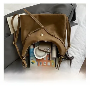 Internal capacity of the brown PU tote bag showing space for tablets and cosmetics